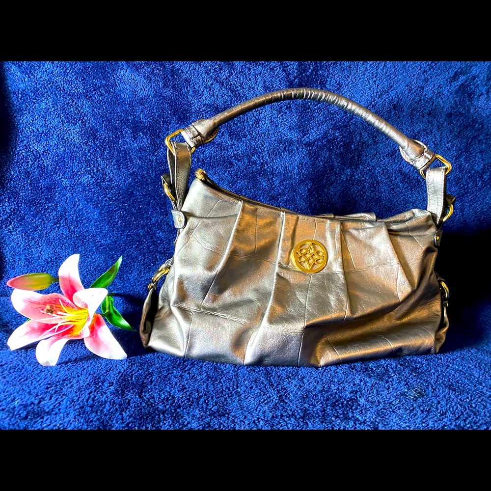 Ladies copper (color) soft leather bag. 3 Inside pocket. Shoulder strap 18”